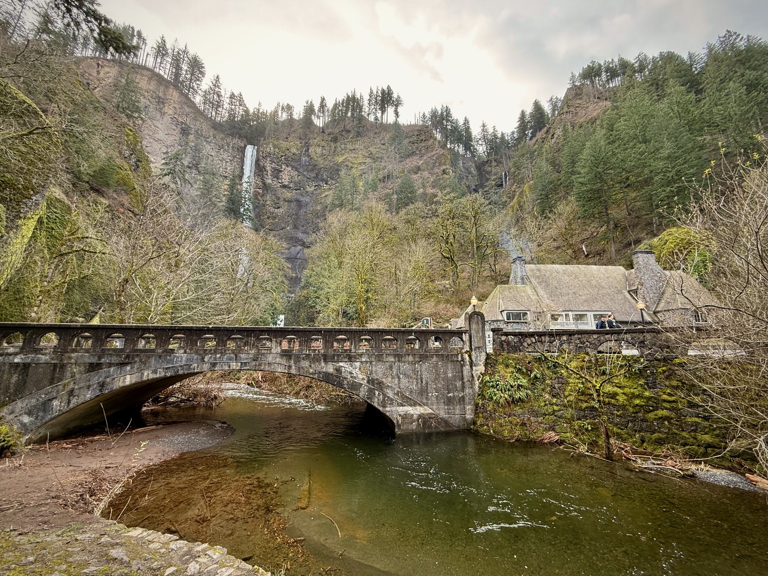 Multnomah Falls and Benson Bridge with water dropping in two tiers.